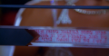 Princess Ardala reads from a ticker-scroll that presents itself in the clear block-shaft of a digital scroll (BR25: Film, "Awakening").