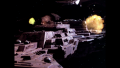 Draconia under attack by "pirates" with amidship explosions (BR25: Film, "Awakening").