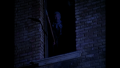 A mutant looks on from a decrepit building, seeing William "Buck" Rogers, Twiki and Dr. Theopolis walk through the ruins of Chicago, Illinois (BR25: Film, "Awakening").