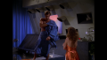 William "Buck" Rogers dries off as Ryma shares information relating to her brother's death relating to Processing Plant 347 (BR25: "Planet of the Slave Girls").
